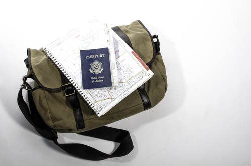 Messenger back with passport and map.